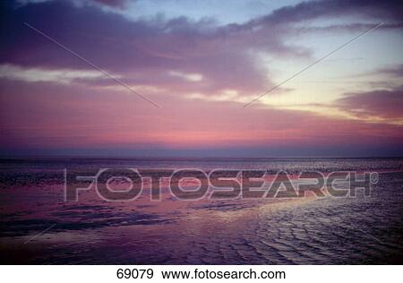 Stock Photo - Beach at dusk, Neuwerk, Hamburg, Germany . Fotosearch