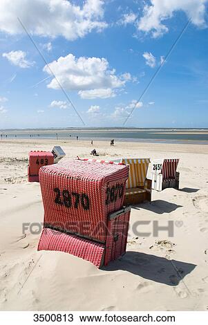Stock Image - Beach chairs on the beach, Langeoog, Germany . Fotosearch