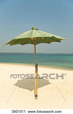 Stock Image - Beach with sunshade, Thailand . Fotosearch