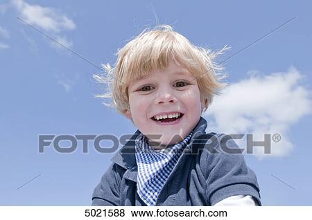 Blond boy playing outside View Large Photo Image Stock Photo - Blond boy playing outside . Fotosearch