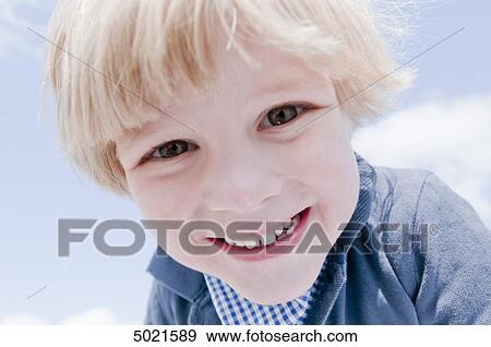 Blond boy playing outside View Large Photo Image Stock Photo - Blond boy playing outside . Fotosearch
