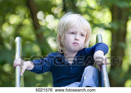 Stock Photograph - Blond girl at playground . Fotosearch
