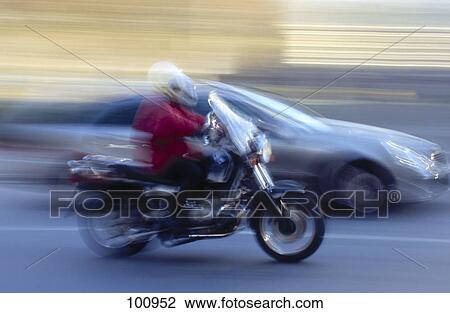 Blurred view of car and motorbike in motion on road View Large Photo Image Stock Image - Blurred view of car and motorbike in motion on road . Fotosearch