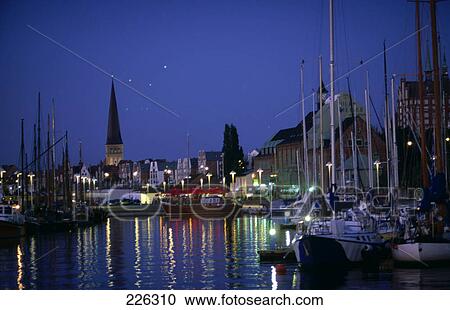 Boats docked at harbor at night, Germany View Large Photo Image Stock Image - Boats docked at harbor at night, Germany . Fotosearch