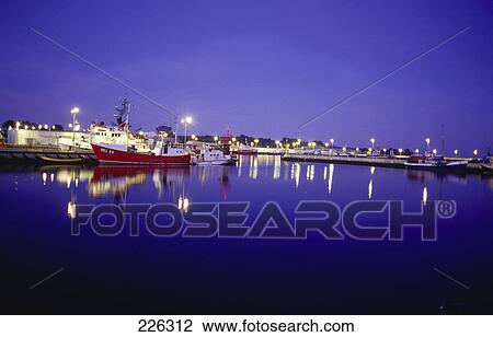 Boats docked at harbor during night View Large Photo Image Stock Image - Boats docked at harbor during night . Fotosearch