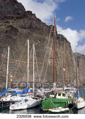 Boats moored at coast, Valle grain Rey, La Gomera, Canary Islands, Spain View Large Photo Image Stock Photo - Boats moored at coast, Valle grain Rey, La Gomera, Canary Islands, Spain . Fotosearch