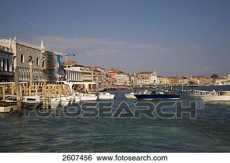 Stock Photograph - Boats moored at harbor, Grand Canal, Veneto, Venice, Italy . Fotosearch
