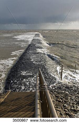 Breakwater at the North Sea in Eckwarderhoerne, Germany View Large Photo Image Stock Photo - Breakwater at the North Sea in Eckwarderhoerne, Germany . Fotosearch