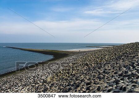 Stock Photo - Breakwater on beach, Wangerooge, Germany . Fotosearch
