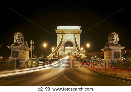 Stock Photo - Bridge lit up at night, Liberty Bridge, Danube River, Budapest, Hungary . Fotosearch