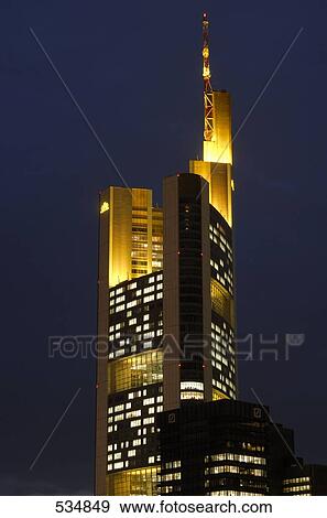 Building in city lit up against evening sky, Commerzbank, Frankfurt, Germany View Large Photo Image Stock Photo - Building in city lit up against evening sky, Commerzbank, Frankfurt, Germany . Fotosearch