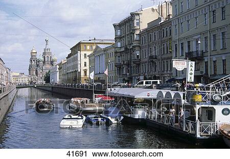 Stock Image - Buildings along canal, Church Of The Savior On Blood, Griboyedov Canal, St. Petersburg, Russia . Fotosearch