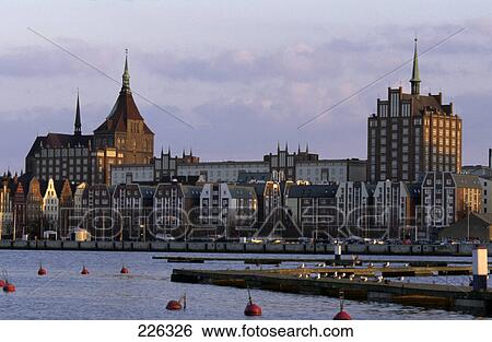 Stock Photograph - Buildings at waterfront, Rostock, Mecklenburg-Western Pomerania, Germany . Fotosearch