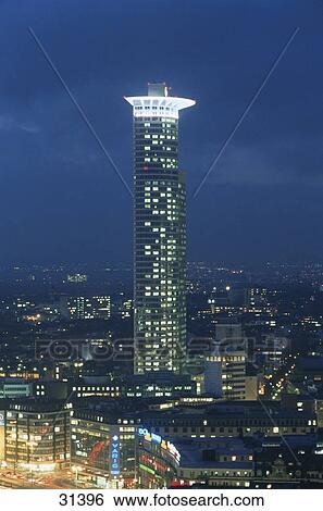 Stock Photograph - Buildings lit up at night, Frankfurt, Germany . Fotosearch