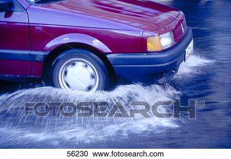 Car on flooded road View Large Photo Image Stock Image - Car on flooded road . Fotosearch