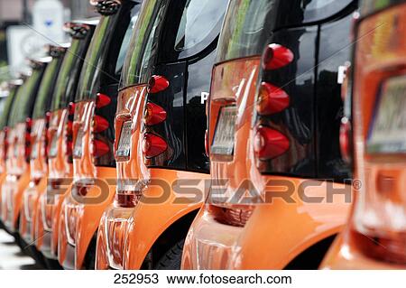 Stock Image - Cars parked in row . Fotosearch