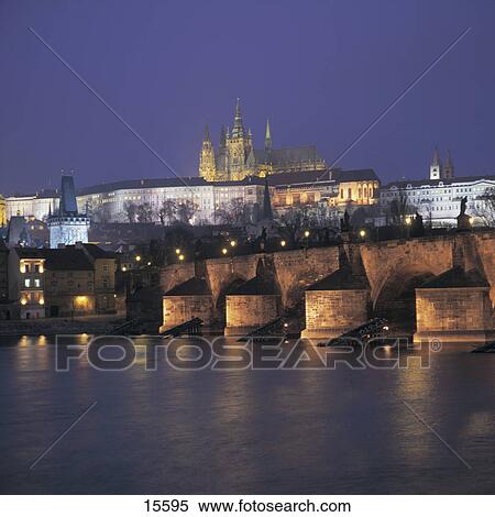 Stock Photography - Castle lit up at night, Karlsbruecke, Moldau River, Prague, Czech Republic . Fotosearch