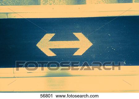 Close-up of arrow sign View Large Photo Image Stock Image - Close-up of arrow sign . Fotosearch