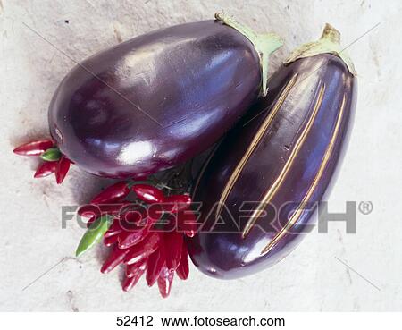 Close-up of aubergines with red chillis View Large Photo Image Stock Image - Close-up of aubergines with red chillis . Fotosearch