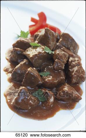 Stock Image - Close-up of beef goulash on plate . Fotosearch