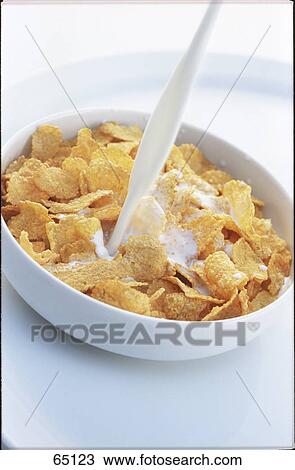Close-up of bowl of corn flakes with milk being poured View Large Photo Image Stock Image - Close-up of bowl of corn flakes with milk being poured . Fotosearch