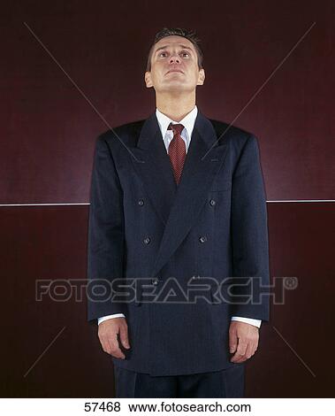 Stock Photo - Close-up of businessman looking upwards . Fotosearch