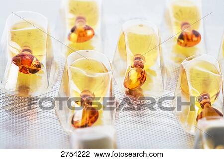 Stock Image - Close-up of capsules in blister pack . Fotosearch
