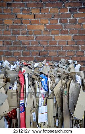 Close-up of cardboard boxes bundled against brick wall View Large Photo Image Stock Photo - Close-up of cardboard boxes bundled against brick wall . Fotosearch