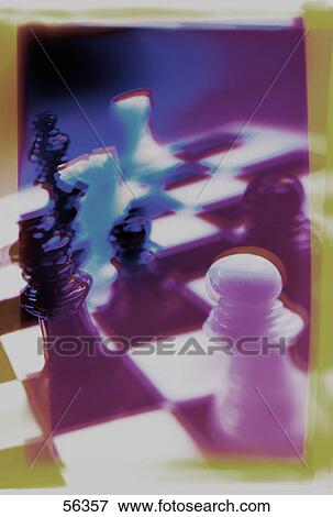 Close-up of chess pieces on chessboard View Large Photo Image Stock Photo - Close-up of chess pieces on chessboard . Fotosearch