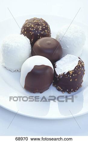 Close-up of chocolates on plate View Large Photo Image Stock Image - Close-up of chocolates on plate . Fotosearch