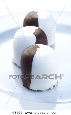 Close-up of chocolates on plate View Large Photo Image Stock Photo - Close-up of chocolates on plate . Fotosearch