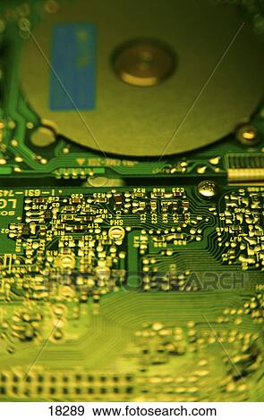Stock Photo - Close-up of circuit board and hard disk . Fotosearch