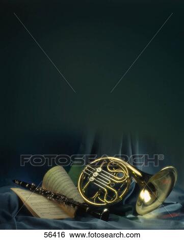 Close-up of clarinet, sheet music and French horn View Large Photo Image Stock Photograph - Close-up of clarinet, sheet music and French horn . Fotosearch