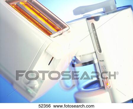 Stock Photograph - Close-up of coffee machine and toaster . Fotosearch