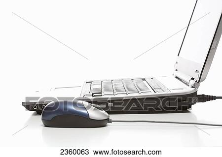 Close-up of computer mouse and laptop View Large Photo Image Stock Image - Close-up of computer mouse and laptop . Fotosearch