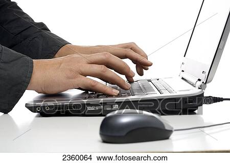 Close-up of computer mouse and person's hands using laptop View Large Photo Image Picture - Close-up of computer mouse and person's hands using laptop . Fotosearch