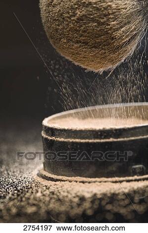 Stock Photo - Close-up of face powder and make-up brush . Fotosearch