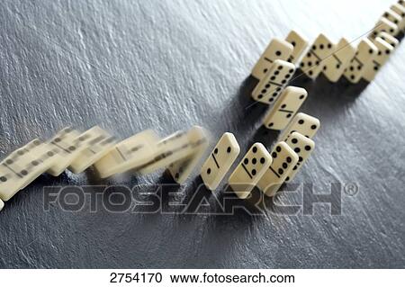 Close-up of falling dominos View Large Photo Image Stock Image - Close-up of falling dominos . Fotosearch