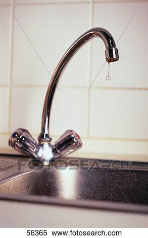 Close-up of faucet at kitchen sink View Large Photo Image Stock Photography - Close-up of faucet at kitchen sink . Fotosearch