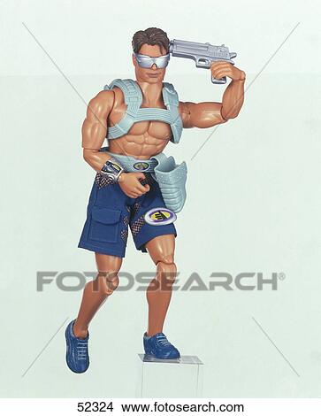Close-up of figurine holding gun View Large Photo Image Picture - Close-up of figurine holding gun . Fotosearch