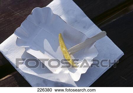 Close-up of french-fries with napkin and fork on paper plate View Large Photo Image Stock Image - Close-up of french-fries with napkin and fork on paper plate . Fotosearch