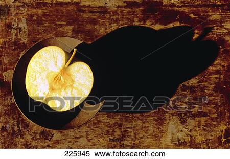 Close-up of half apple in bowl View Large Photo Image Stock Photography - Close-up of half apple in bowl . Fotosearch