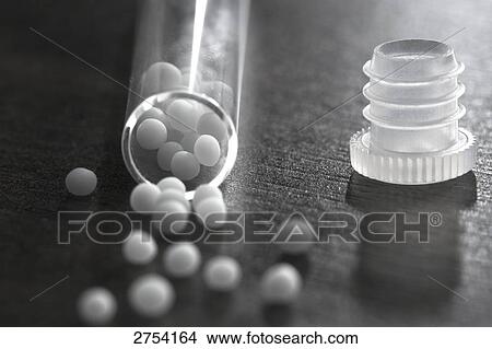 Picture - Close-up of homeopathic medicine and test tube . Fotosearch