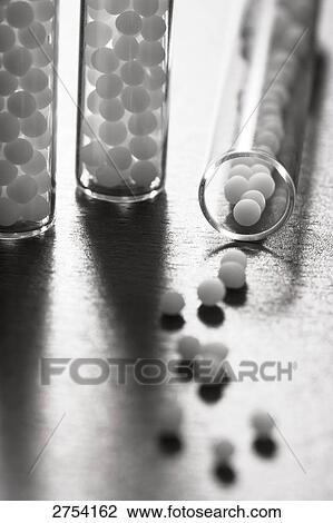 Stock Image - Close-up of homeopathic medicine and test tubes . Fotosearch