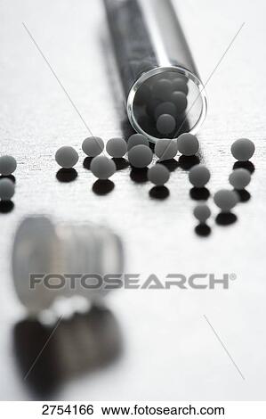 Stock Photograph - Close-up of homeopathic medicine and test tube . Fotosearch