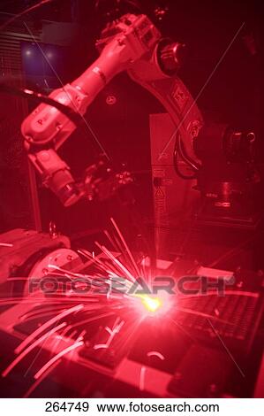 Stock Photo - Close-up of industrial robot sparks . Fotosearch