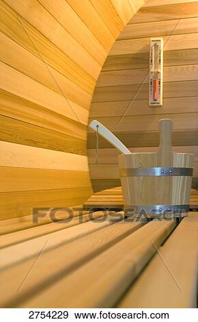 Close-up of ladle in wooden bucket View Large Photo Image Stock Photo - Close-up of ladle in wooden bucket . Fotosearch