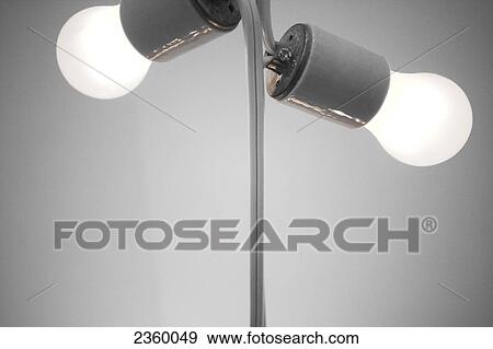 Close-up of light bulb on mirror View Large Photo Image Stock Photo - Close-up of light bulb on mirror . Fotosearch