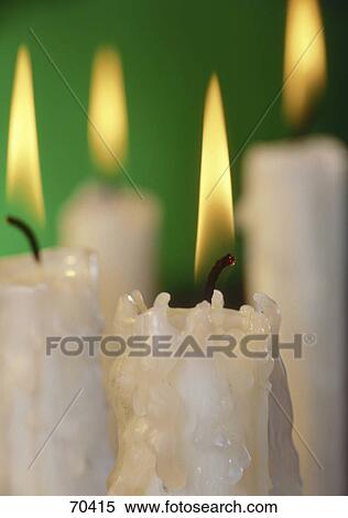Close-up of lit candles View Large Photo Image Stock Photography - Close-up of lit candles . Fotosearch