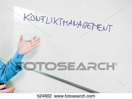 Close-up of man explaining on whiteboard View Large Photo Image Stock Image - Close-up of man explaining on whiteboard . Fotosearch